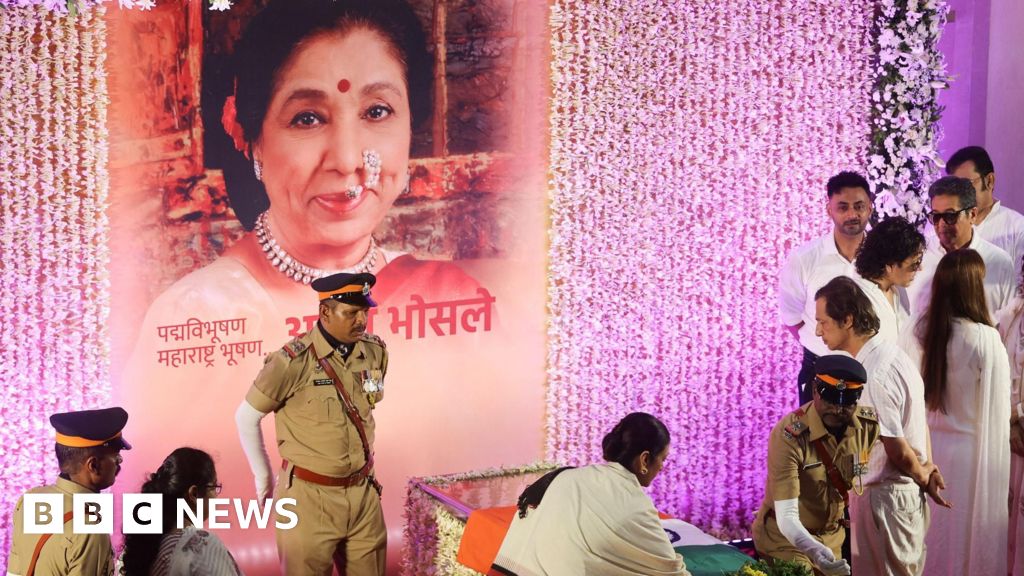 Mourners sing Asha Bhosle hit as iconic Indian singer cremated