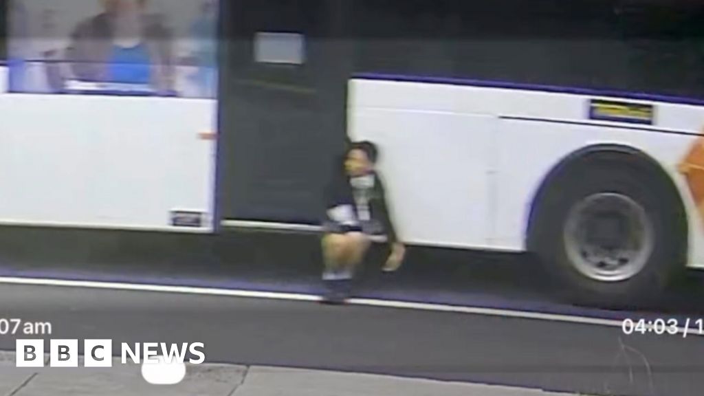 Trapped boy dangles from moving bus in Australia