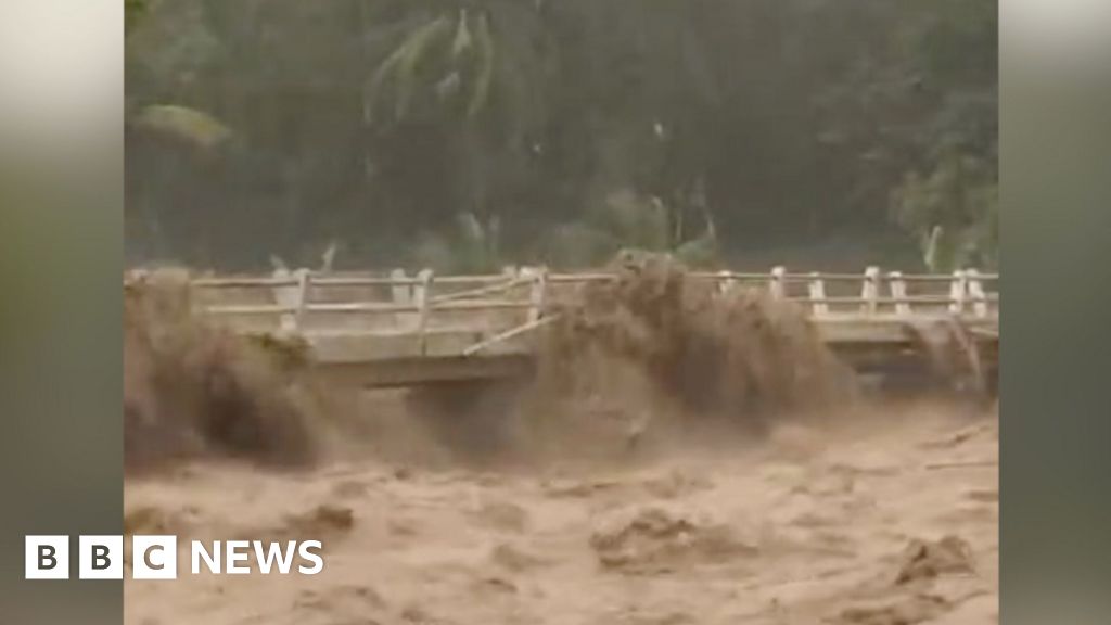 Moment Indonesian river overflows from heavy rain