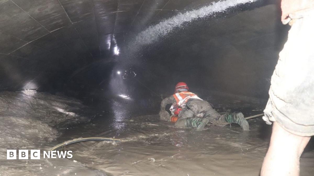 Nepal rescuers try to reach dozens trapped in tunnel after two pulled out alive